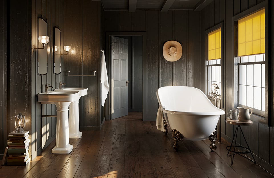 Un bagno con le pareti scure in stile cottagecore. I sanitari sono vintage: ci sono due lavandini, una vasca coi piedi e un cappello di paglia appeso alla parete