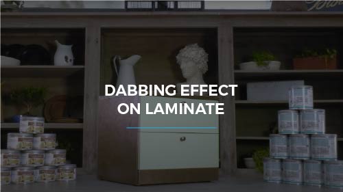 Dabbing effect on laminate with metal coatings