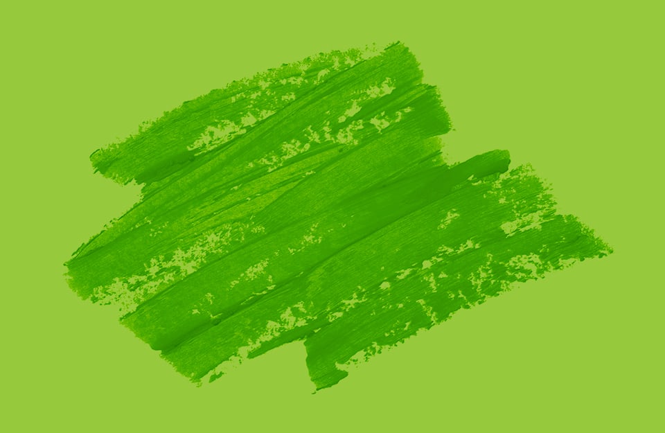 Tracce di colore a cera verde su sfondo verde-giallo
