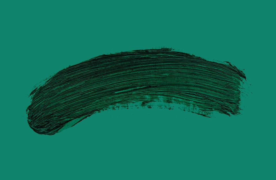 Una pennellata di vernice verde scura su sfondo verde veronese