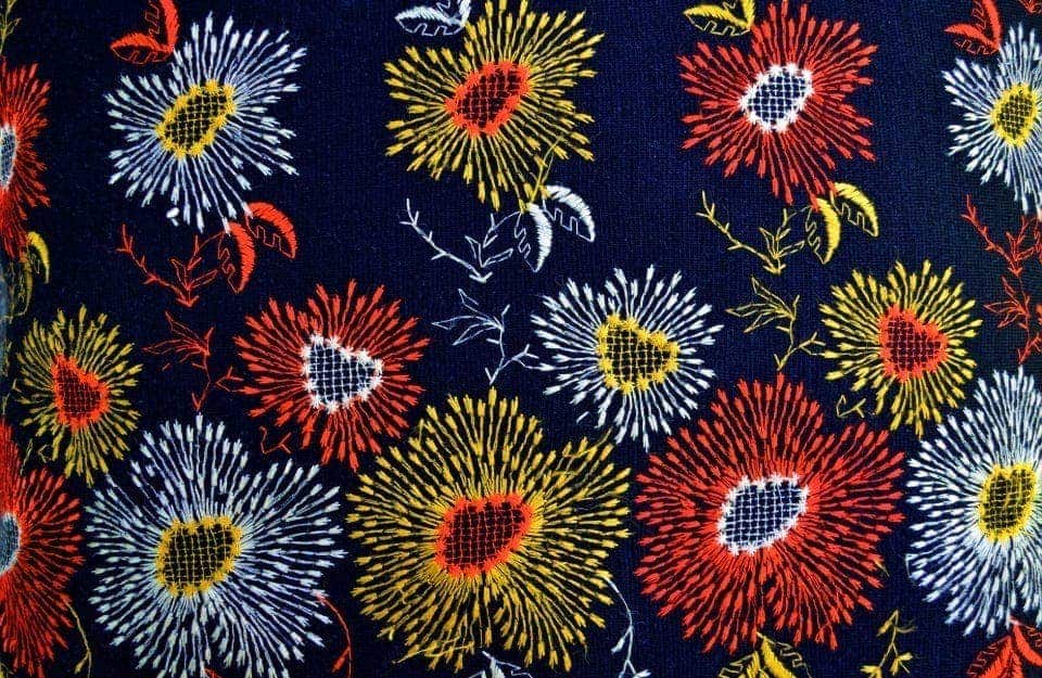 A fabric embroidered with a colourful traditional Ukrainian floral pattern